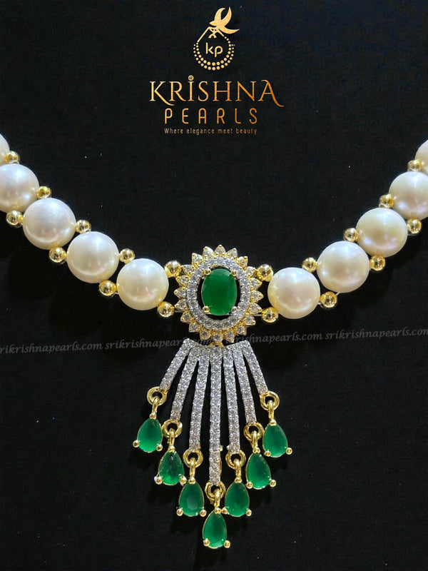 Luxurious Emerald Studded Pendent With Button Pearls Necklace Set