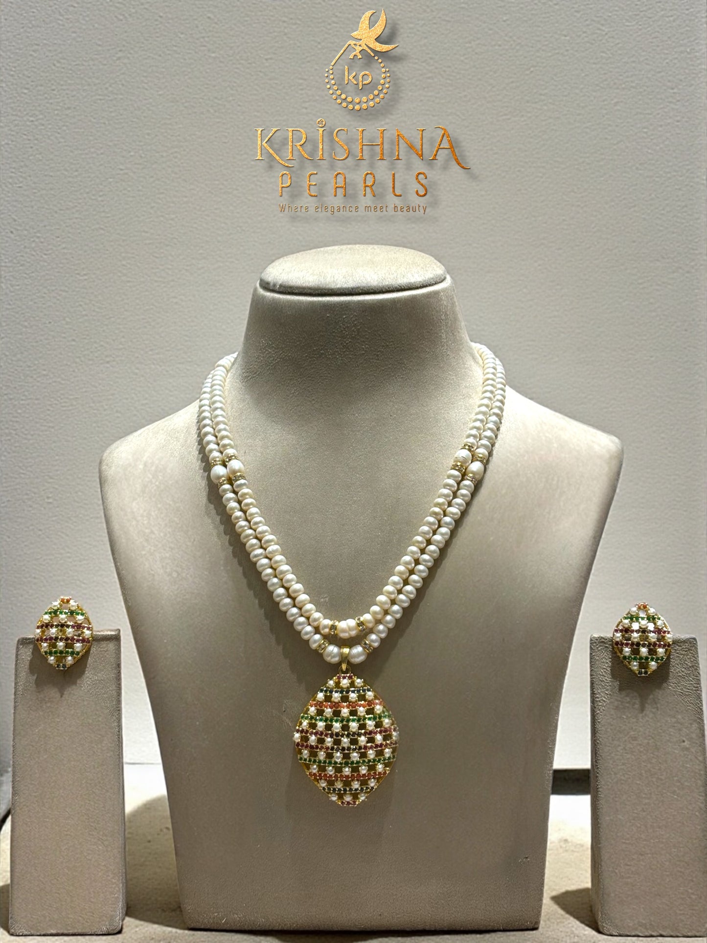 Navratna-Inspired Hyderabadi Pearl Necklace Set with Blue Sapphire, Coral, Ruby & Emerald