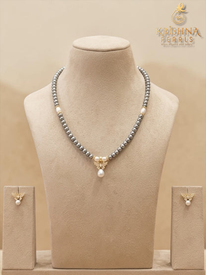 Beautiful Butterfly Grey Pearl Studded Pearls Combo Set ( Single Line Pendent Set With Finger Ring )