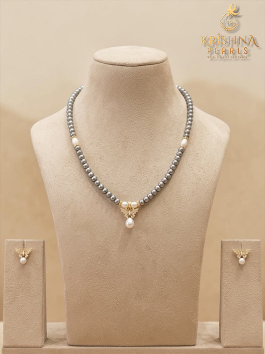 Beautiful Butterfly Grey Pearl Studded Pearls Combo Set ( Single Line Pendent Set With Finger Ring )